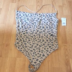 Tan and black leopard body suit